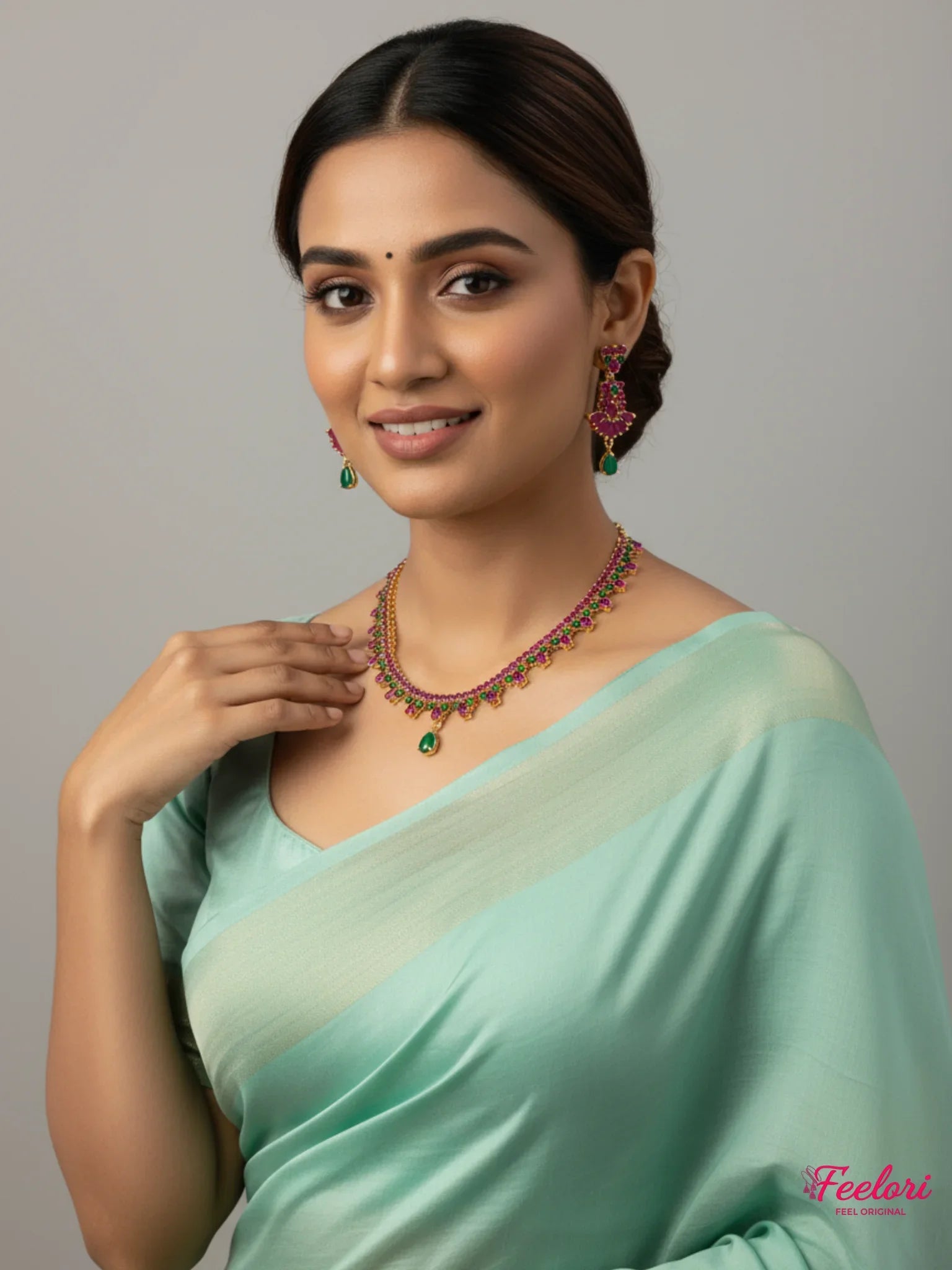 FeelOri Gold Plated Ruby Emerald Vine Necklace Set - Model wearing elegant set with pink saree.