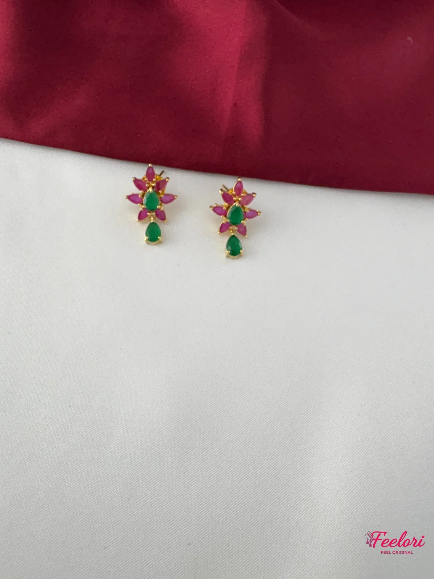 FeelOri Gold Plated Ruby Emerald Floral Earrings - Close-up view of the matching push-back earrings with central emerald stone and ruby petals.