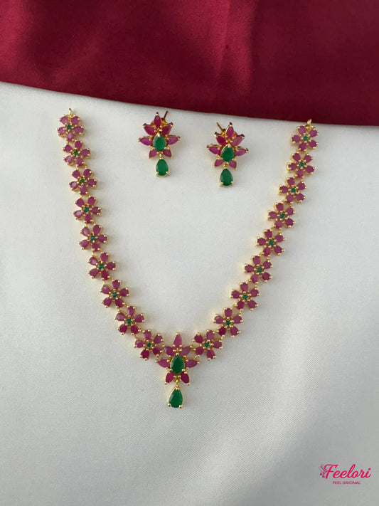 FeelOri Gold Plated Ruby Emerald Floral Necklace Set - Full view showing delicate necklace with tear-drop emerald pendant and matching earrings.
