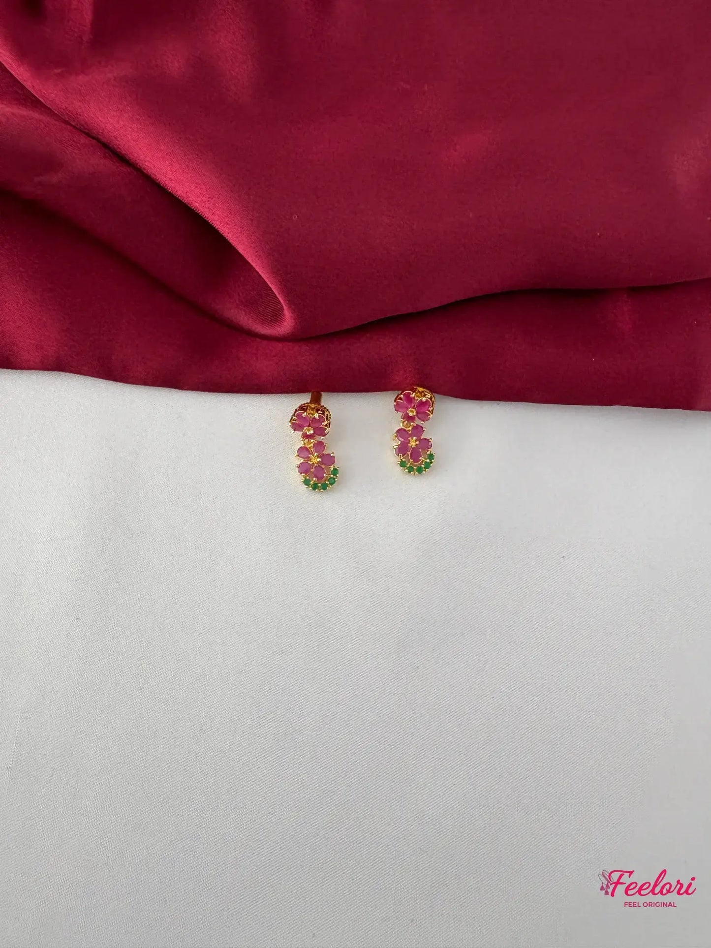 FeelOri Gold Plated Floral Ruby Emerald Earrings - Close-up view of the matching earrings showcasing the intricate ruby and emerald cluster arrangement.