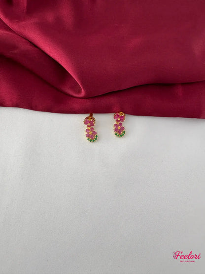 FeelOri Gold Plated Floral Ruby Emerald Earrings - Close-up view of the matching earrings showcasing the intricate ruby and emerald cluster arrangement.