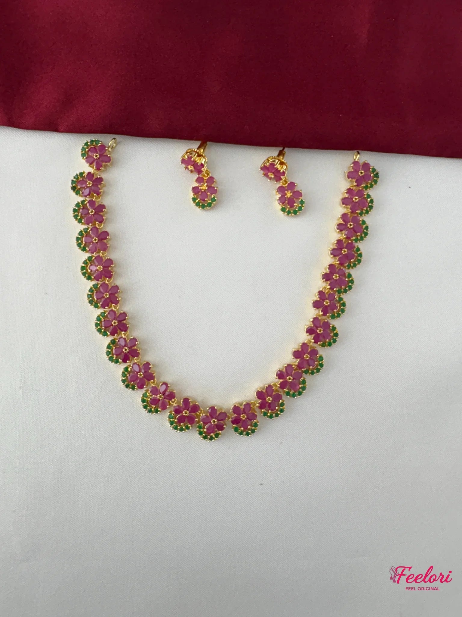 FeelOri Gold Plated Floral Ruby Emerald Necklace Set - Full view of the necklace and matching earrings featuring delicate clustered floral motifs.