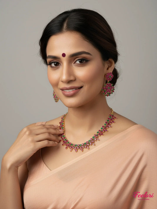 FeelOri Gold Plated Ruby Emerald Necklace Set - Model wearing elegant set with peach saree.