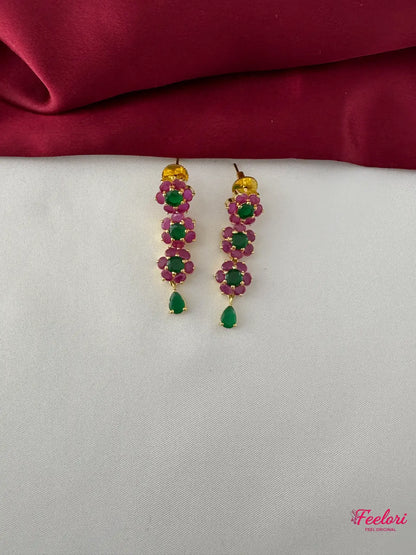 FeelOri Gold Plated Ruby Emerald Floral Petal Earrings - Close-up view of the dangle earrings, highlighting the genuine ruby and emerald petal design and teardrop drop.