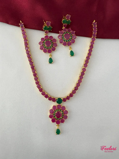 FeelOri Gold Plated Ruby Emerald Necklace Set - Full front view showcasing the floral pendant and matching earrings.