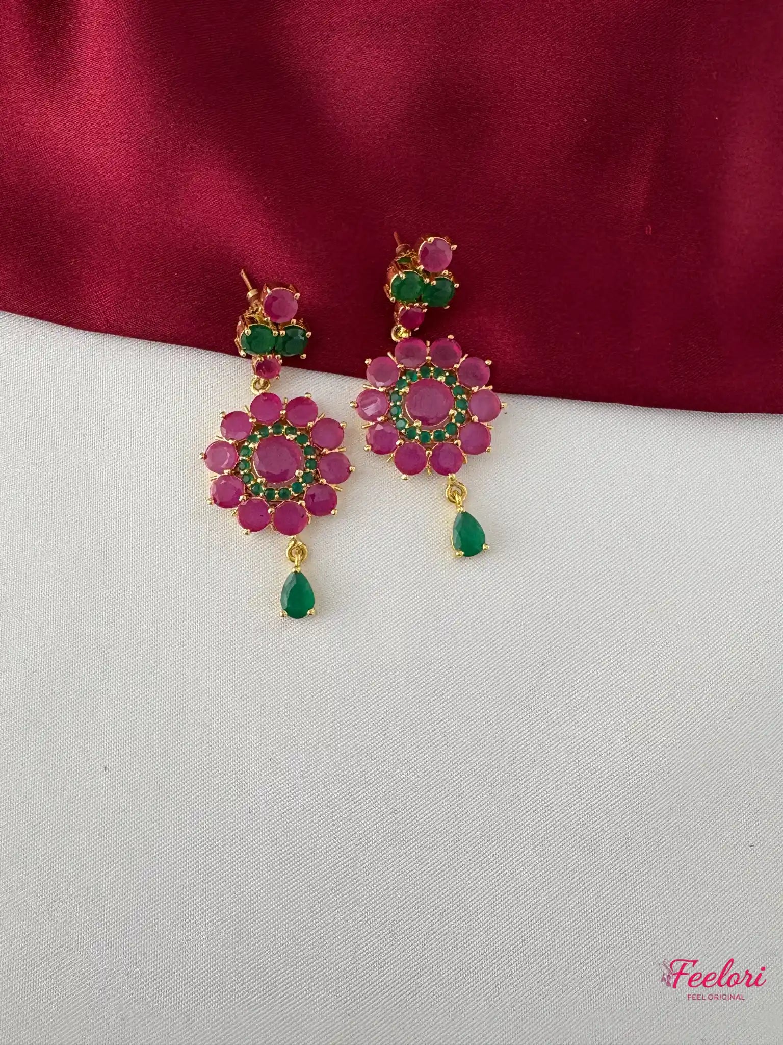 FeelOri Gold Plated Ruby Emerald Earrings - Close-up view of the intricate floral motif and emerald teardrop detail.
