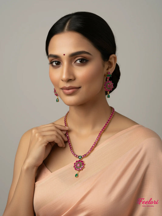 FeelOri Gold Plated Ruby Emerald Flower Necklace Set - Model wearing set with elegant peach saree.