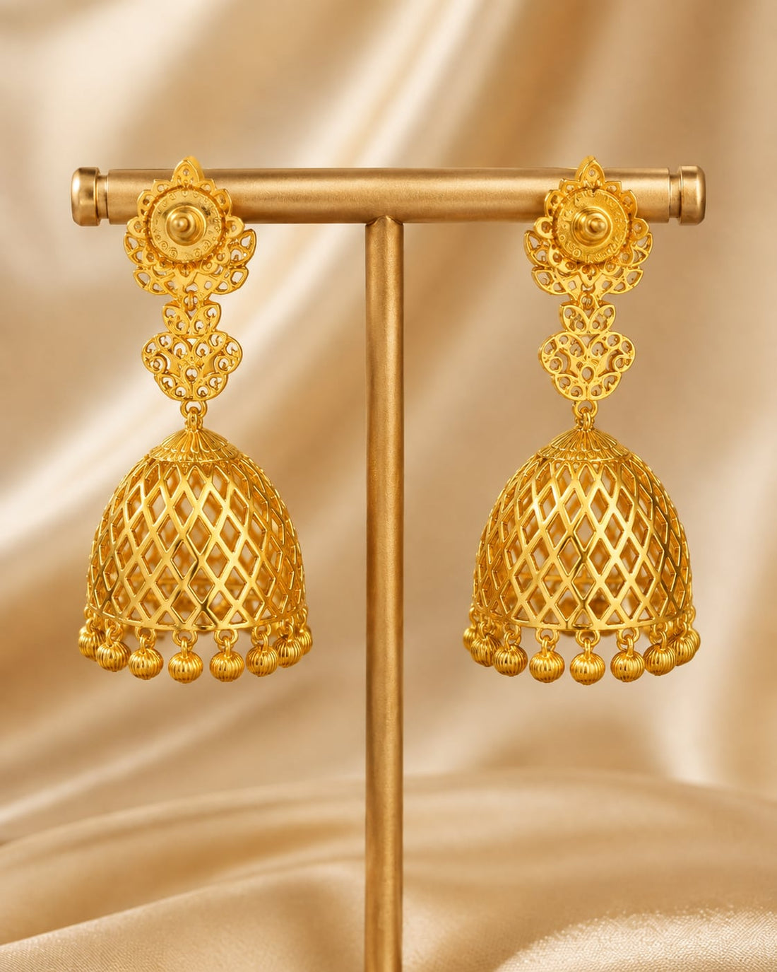Rear view of openwork CZ jhumka earrings with straight posts and push-back closures