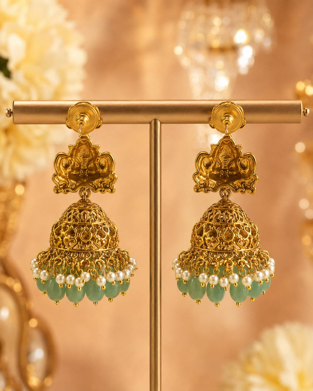 FeelOri gold-plated ruby and emerald jhumka earrings rear view showing openwork reverse, straight posts, and push-back closures