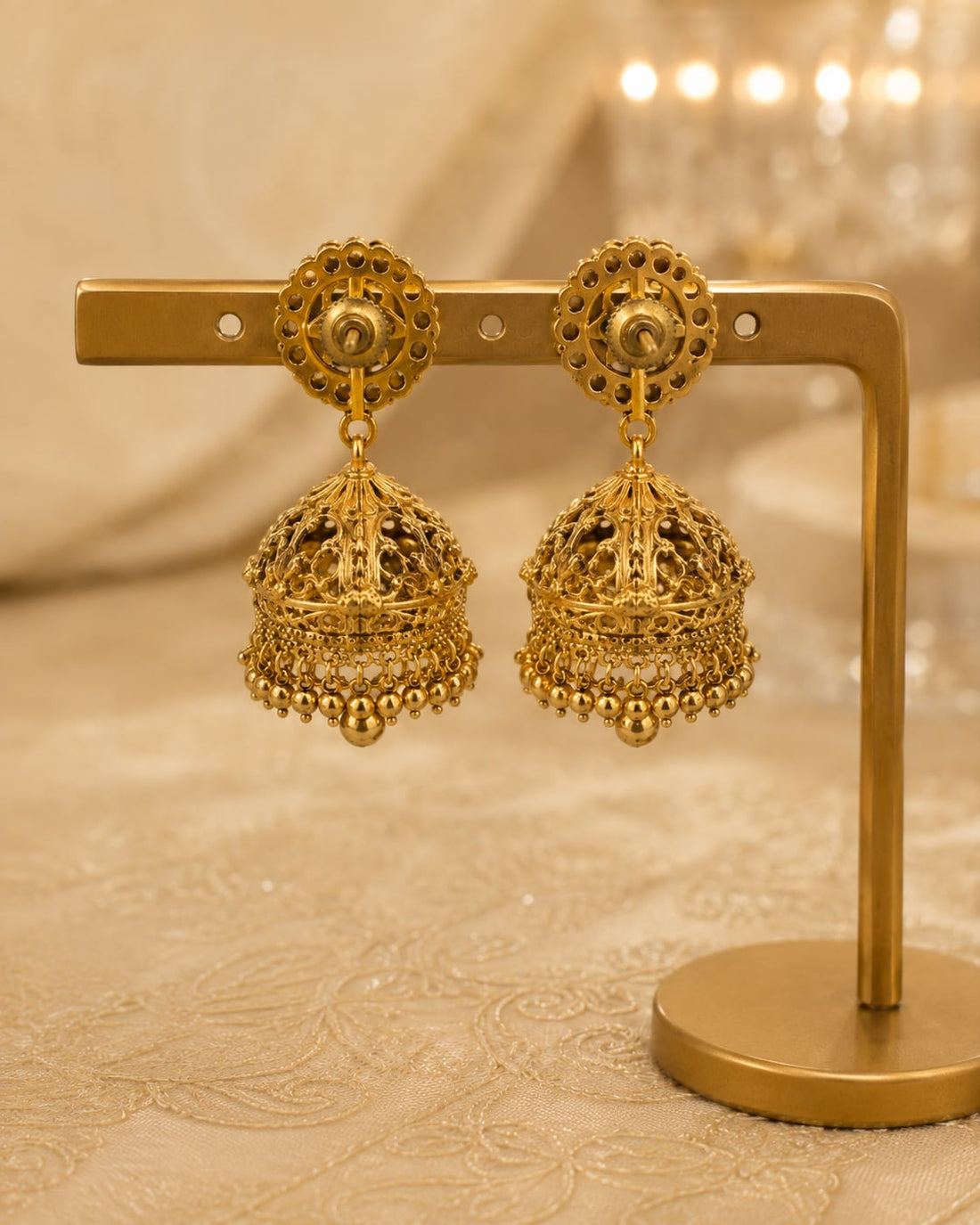 FeelOri gold-plated ruby and emerald jhumka earrings rear view showing openwork reverse, straight posts, and push-back closures