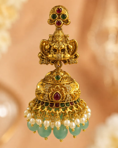 FeelOri gold-plated ruby and emerald jhumka earrings stone setting, ear-chain or earring construction, and gold-plated finish detail