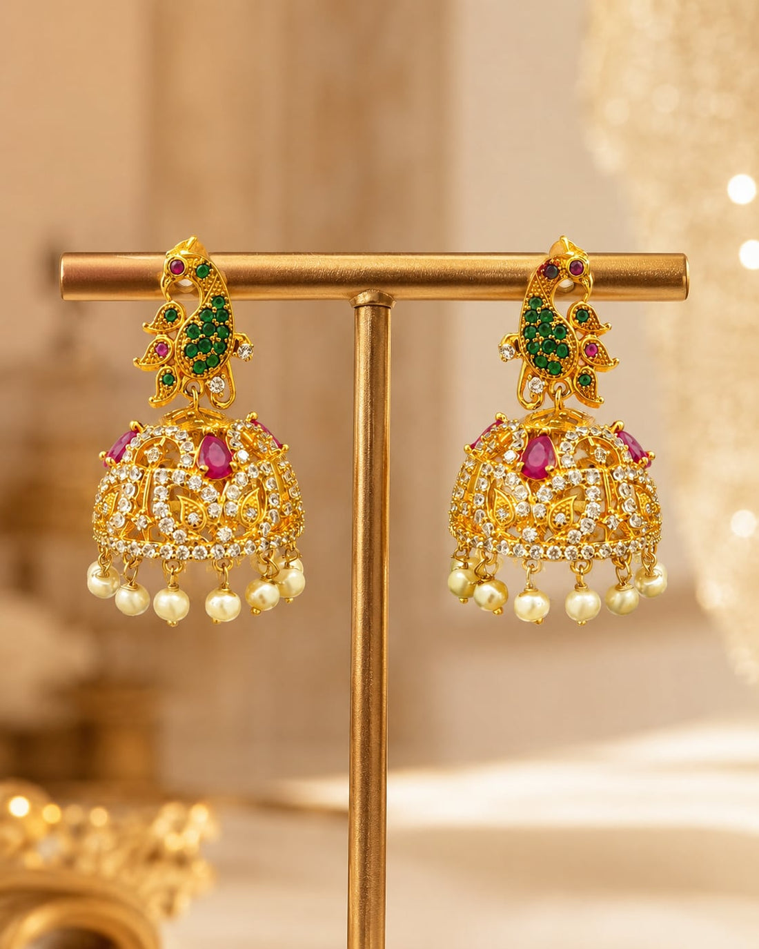 FeelOri gold-plated ruby emerald floral CZ jhumka earrings displayed as a matching pair