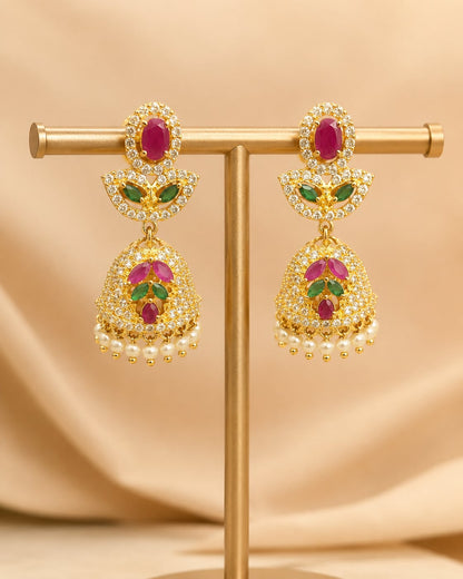 FeelOri petite gold-plated ruby emerald butterfly CZ jhumka earrings displayed as a matching pair