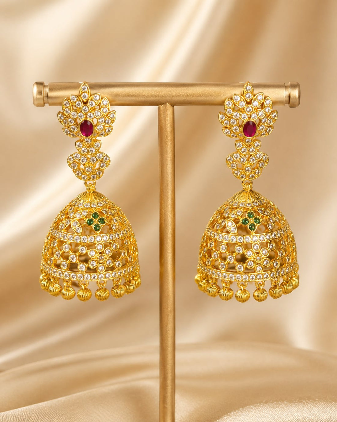 Pair of FeelOri gold-plated openwork CZ jhumka earrings, front view