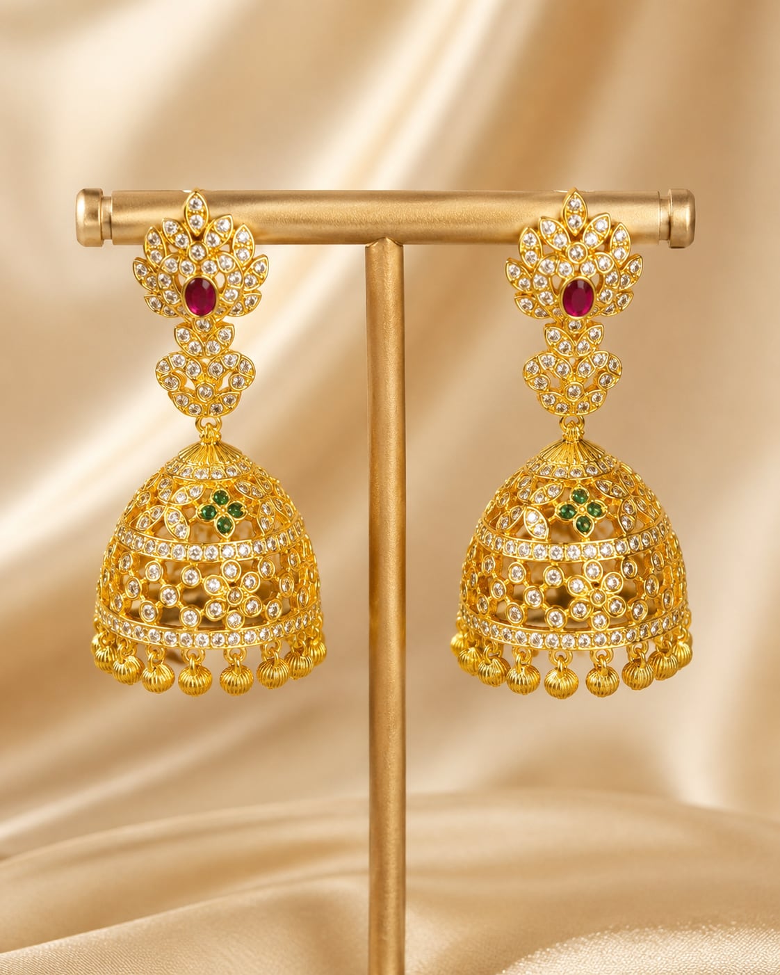 Pair of FeelOri gold-plated openwork CZ jhumka earrings, front view