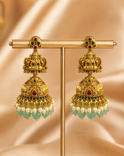 FeelOri gold-plated ruby and emerald jhumka earrings for sarees, kurtas, and festive styling