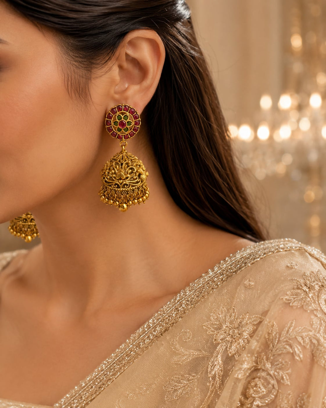 FeelOri gold-plated ruby and emerald jhumka earrings styled with Indian occasion wear