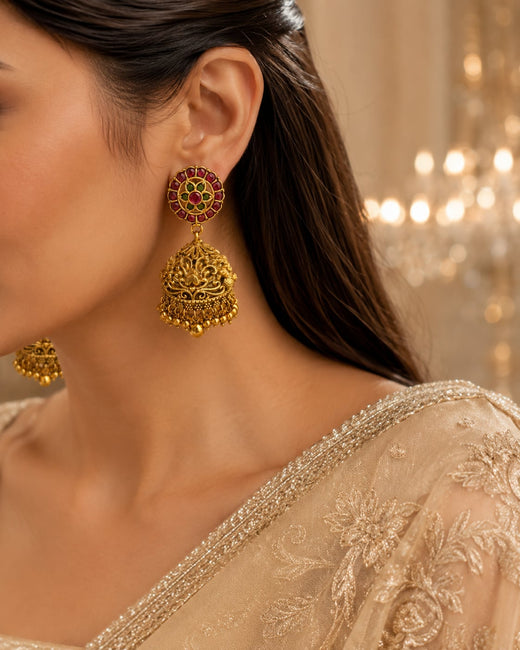 FeelOri gold-plated ruby and emerald jhumka earrings styled with Indian occasion wear