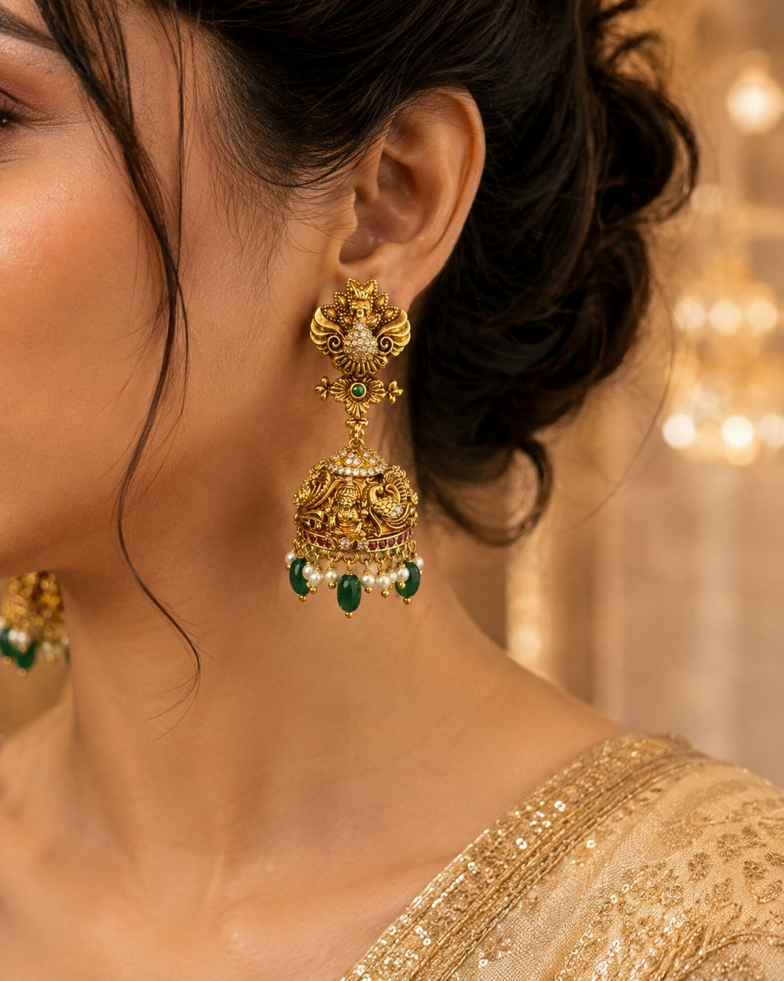 FeelOri gold-plated ruby and emerald jhumka earrings styled with Indian occasion wear