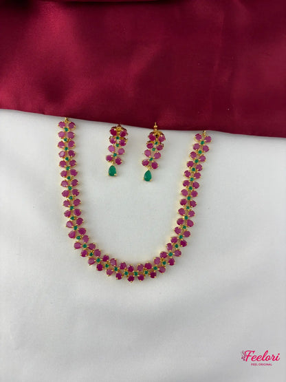 FeelOri Gold Plated Ruby Emerald Leaf Motif Necklace Set - Full view showcasing the necklace with its delicate cluster design and matching earrings.
