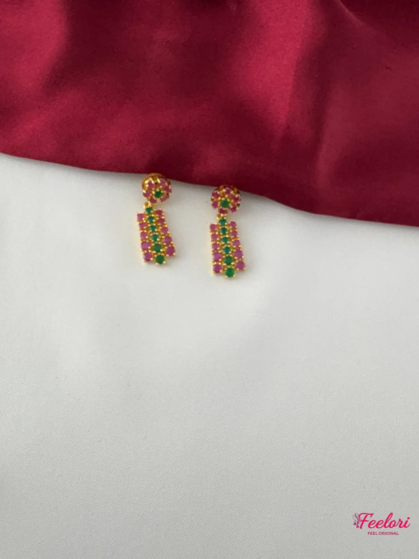 FeelOri Gold Plated Ruby Emerald Earrings - Detailed view highlighting the intricate geometric pattern and genuine stone settings of the earrings.