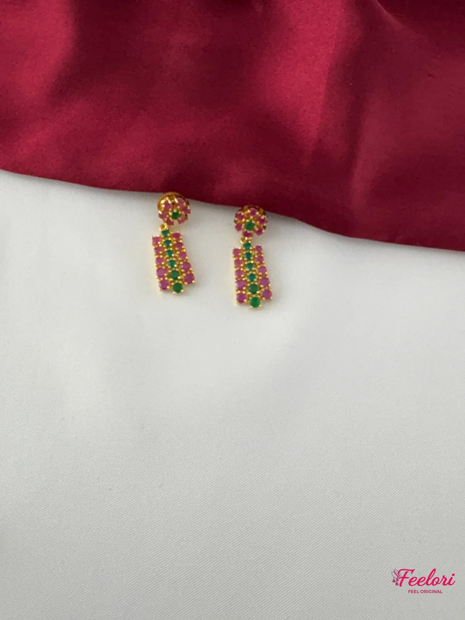 FeelOri Gold Plated Ruby Emerald Earrings - Detailed view highlighting the intricate geometric pattern and genuine stone settings of the earrings.