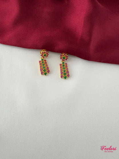 FeelOri Gold Plated Ruby Emerald Earrings - Detailed view highlighting the intricate geometric pattern and genuine stone settings of the earrings.