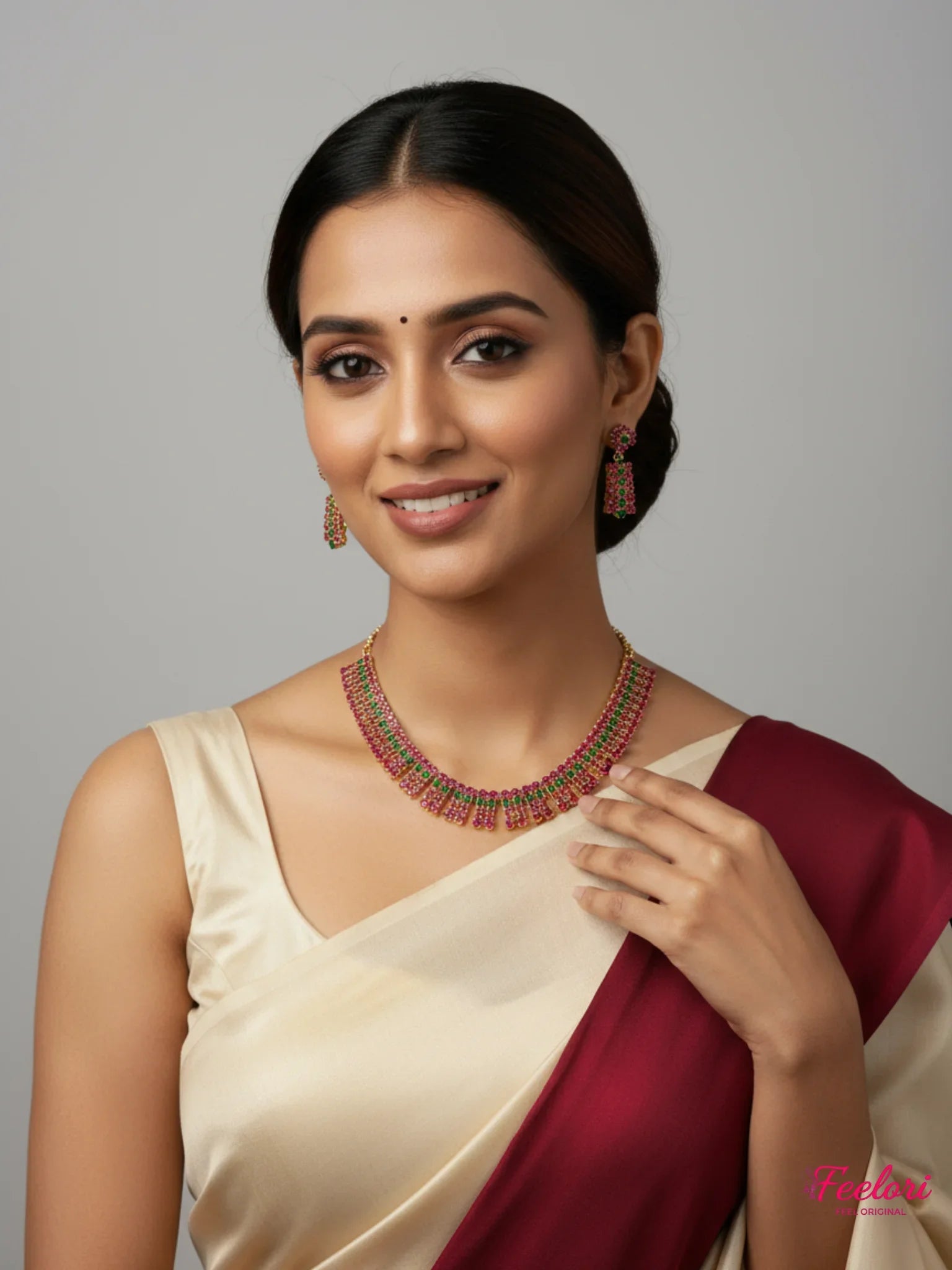 FeelOri Gold Plated Ruby Emerald Necklace Set - Model wearing vibrant set with saree at festive event