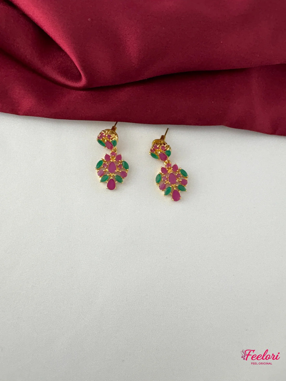 FeelOri Gold Plated Ruby Emerald Petal Earrings - Close-up view highlighting the intricate ruby and emerald petal arrangement and push-back closure.