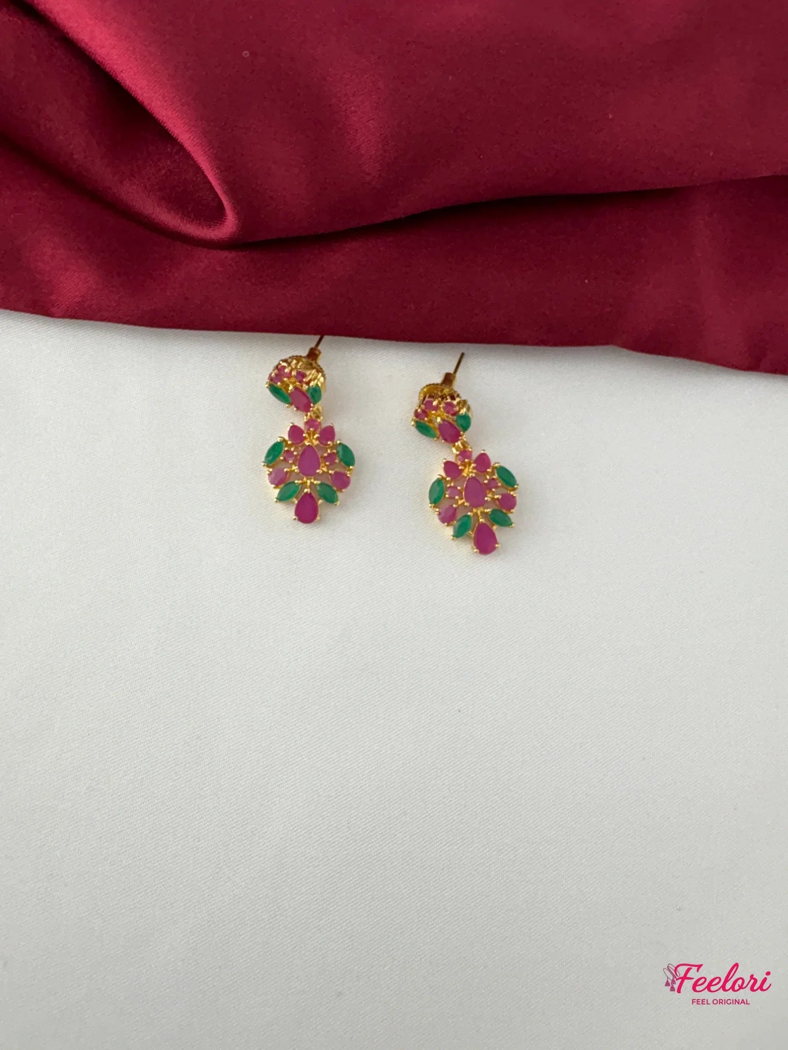 FeelOri Gold Plated Ruby Emerald Petal Earrings - Close-up view highlighting the intricate ruby and emerald petal arrangement and push-back closure.