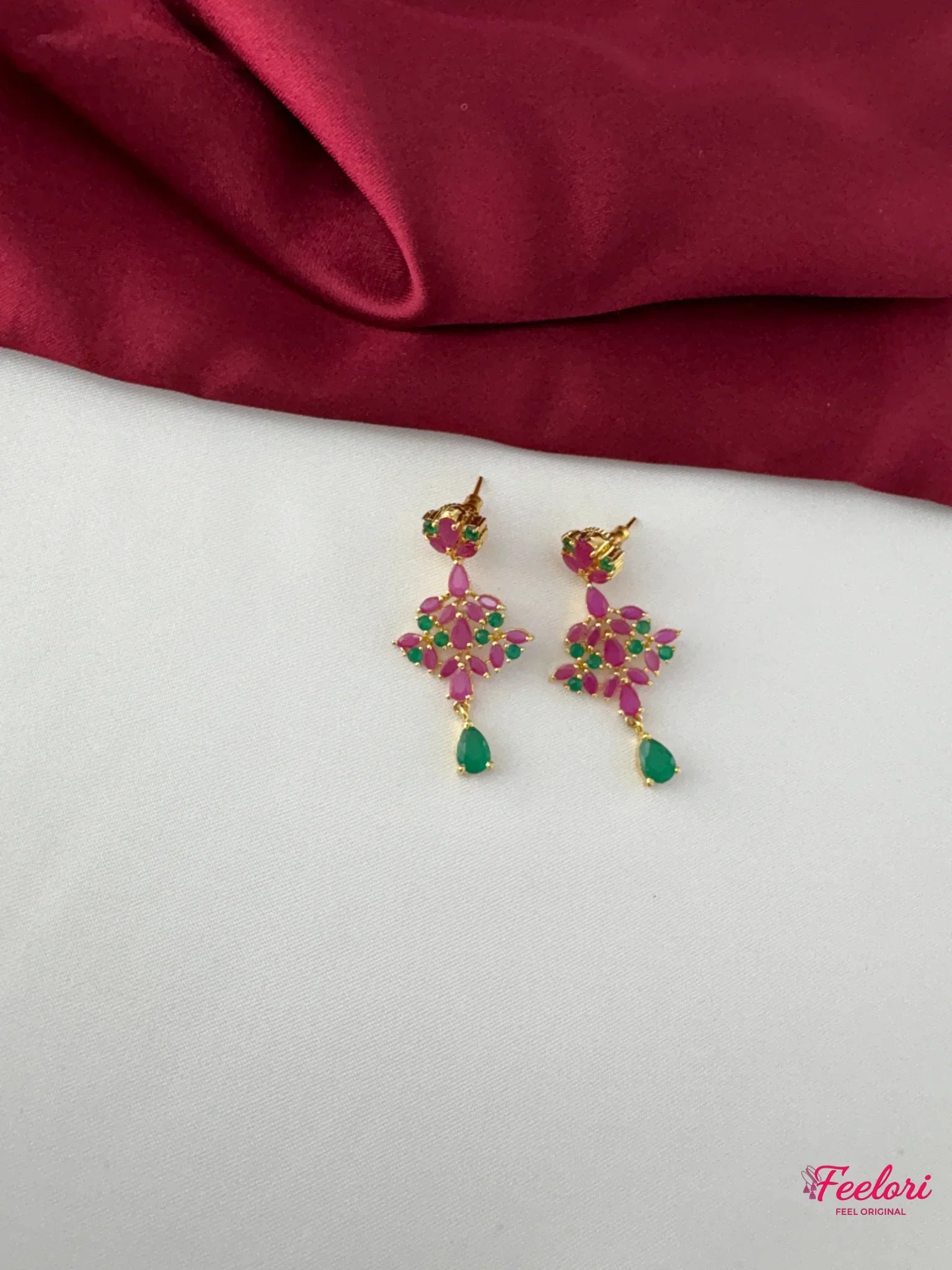 FeelOri Gold Plated Ruby Emerald Earrings - Close-up view highlighting the detailed floral cluster of Ruby CZ and emerald stones with a teardrop emerald accent.