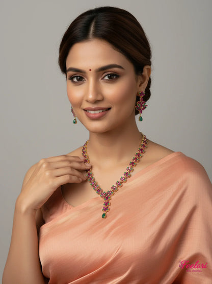 FeelOri Gold Plated Ruby Emerald Necklace Set - Model wearing elegant set with traditional saree.