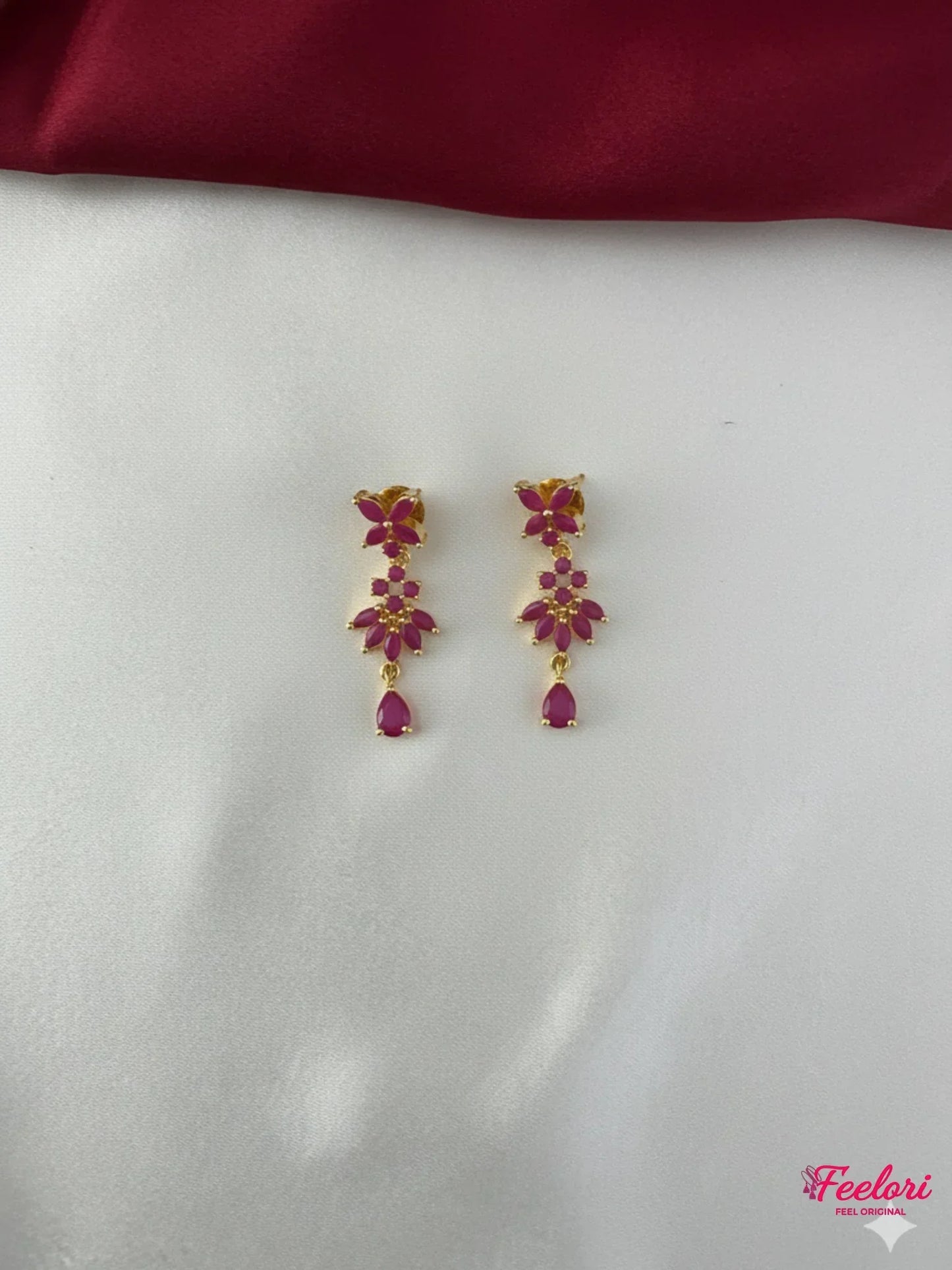 FeelOri Gold Plated Ruby Floral Earrings - Close-up view of the matching floral drop earrings with genuine ruby-hued stones and push-back findings.
