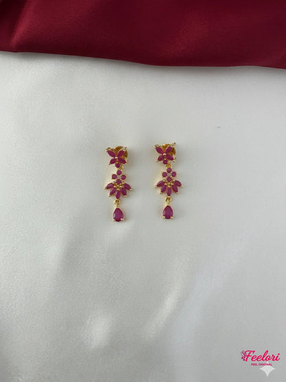 FeelOri Gold Plated Ruby Floral Earrings - Close-up view of the matching floral drop earrings with genuine ruby-hued stones and push-back findings.