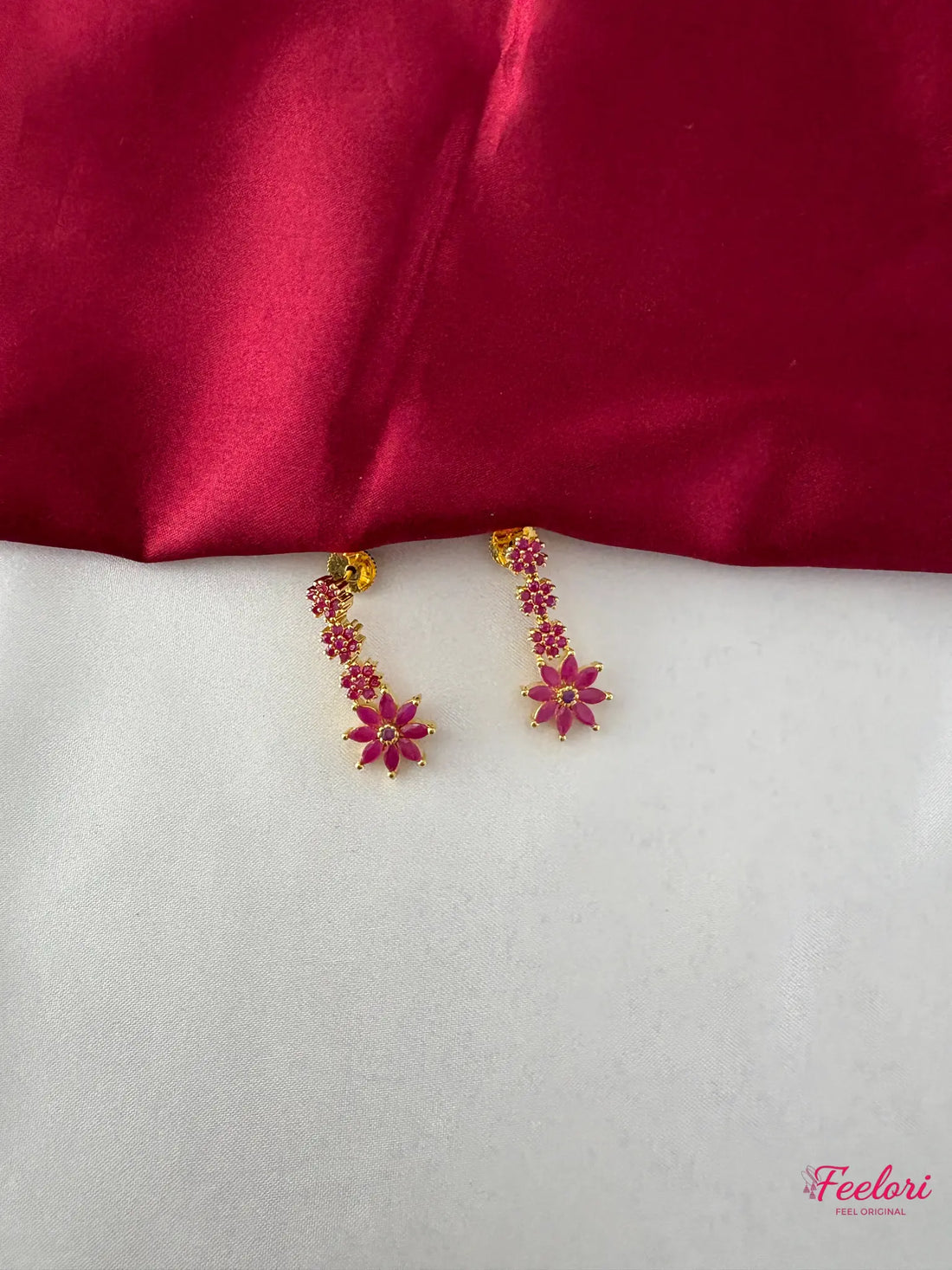 FeelOri Gold Plated Ruby Floral Earrings - Detailed view showing intricate petal design and push-back closures.