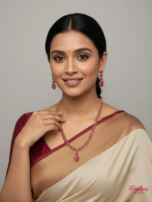 FeelOri Gold Plated Ruby Floral Necklace Earring Set - Model wearing set with traditional saree, smiling confidently