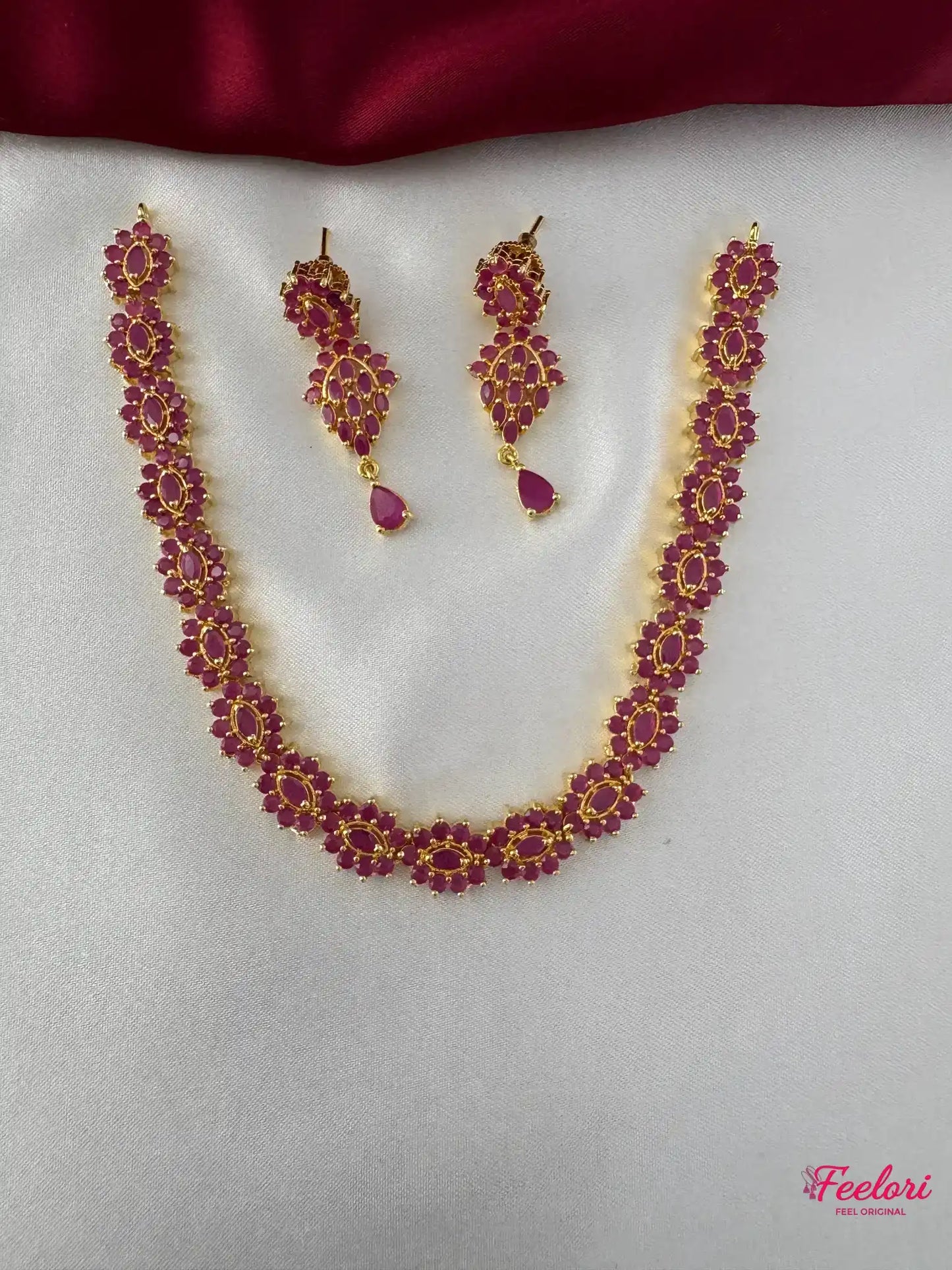 FeelOri Gold Plated Ruby Floral Necklace and Earring Set - Front view showcasing the complete set with intricate ruby-hued stone arrangement.
