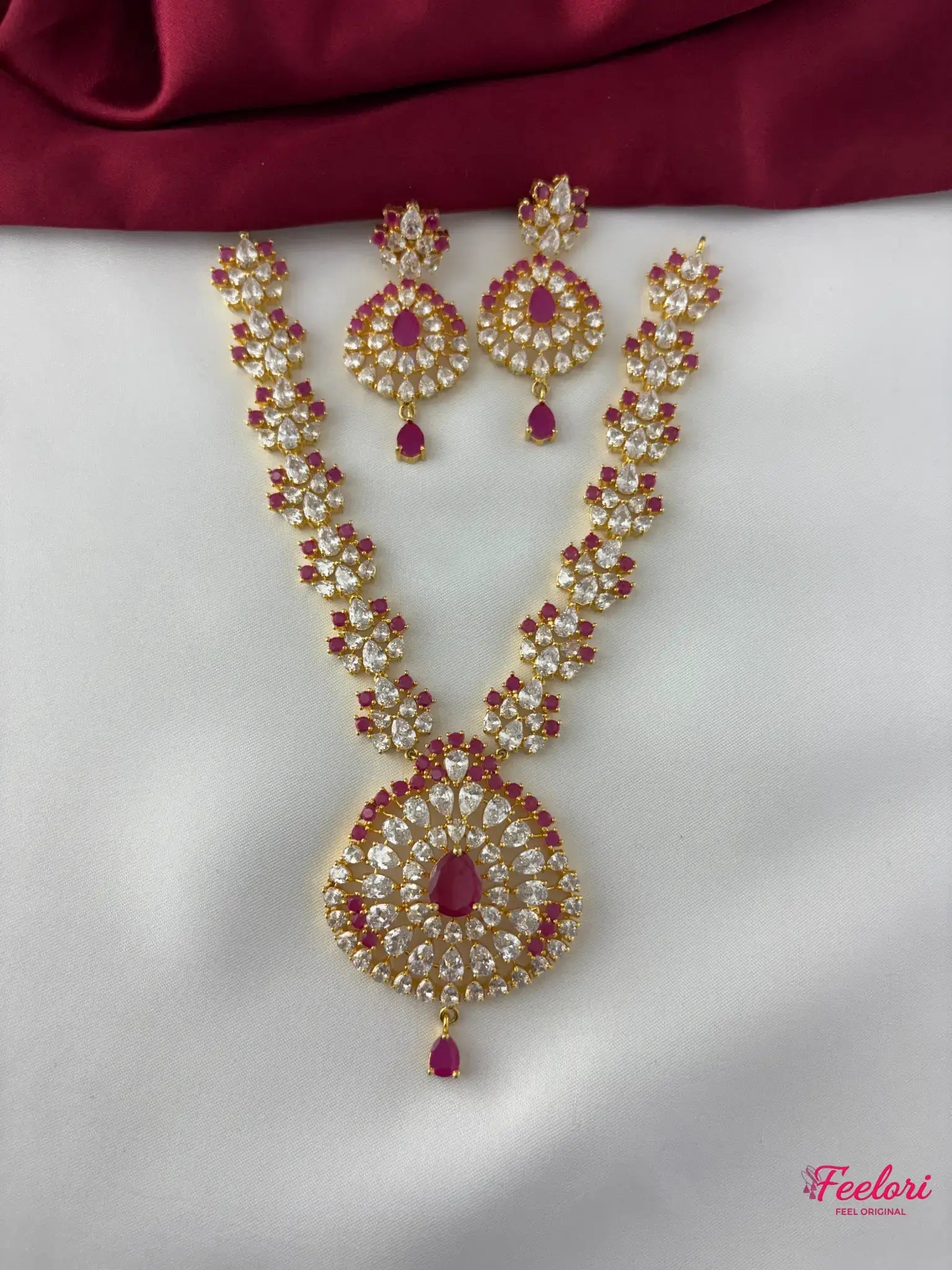 FeelOri Gold Plated Ruby Flower Halo Necklace Set - Front view showcasing the ornate necklace with its central ruby-hued pendant and matching earrings.