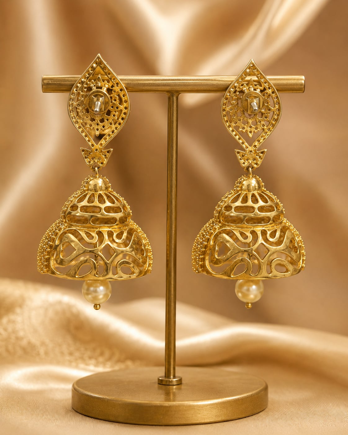 Rear view of FeelOri gold-plated ruby paisley CZ bell jhumka earrings showing threaded screw-back closures