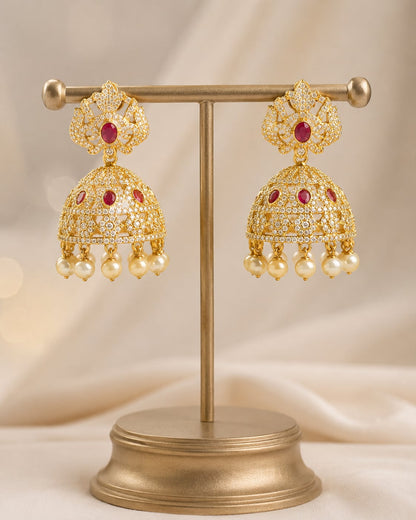 FeelOri gold-plated ruby crown CZ jhumka earrings with pearl-look fringe displayed as a matching pair