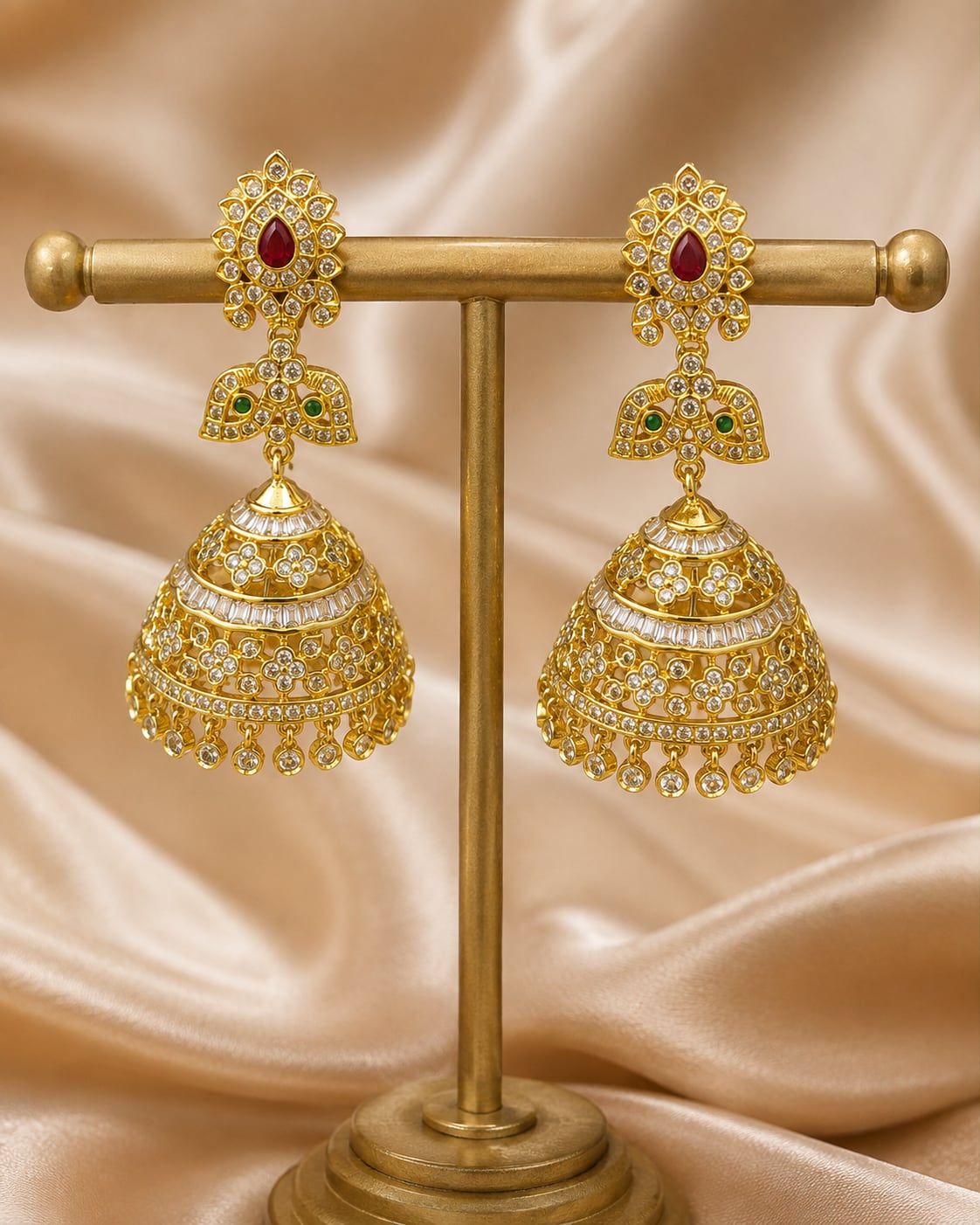 FeelOri gold-plated ruby butterfly CZ jhumka earrings with pearl-look fringe displayed as a matching pair