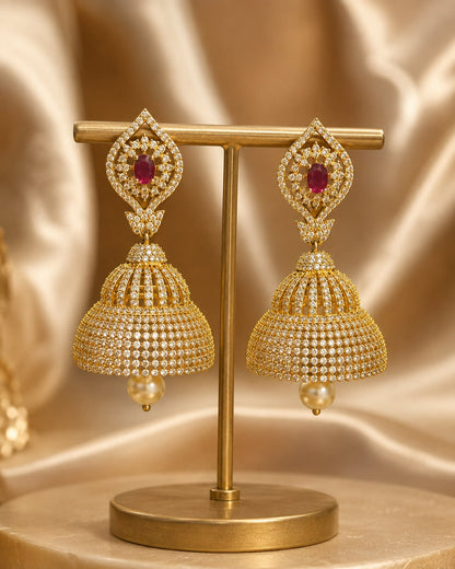 FeelOri gold-plated ruby paisley CZ bell jhumka earrings displayed as a matching pair