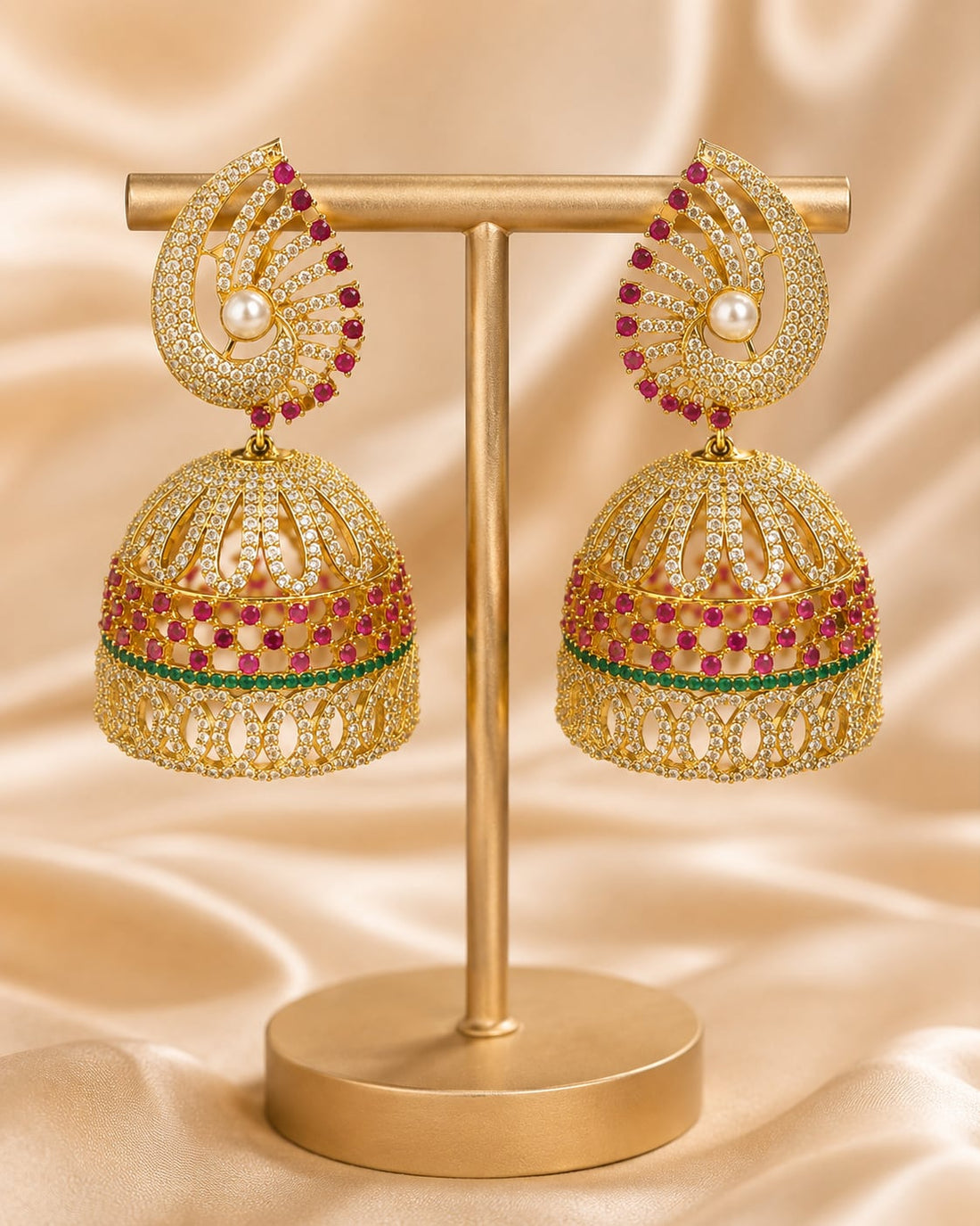 FeelOri gold-plated ruby fan CZ jhumka earrings with pearl-look drops displayed as a matching pair