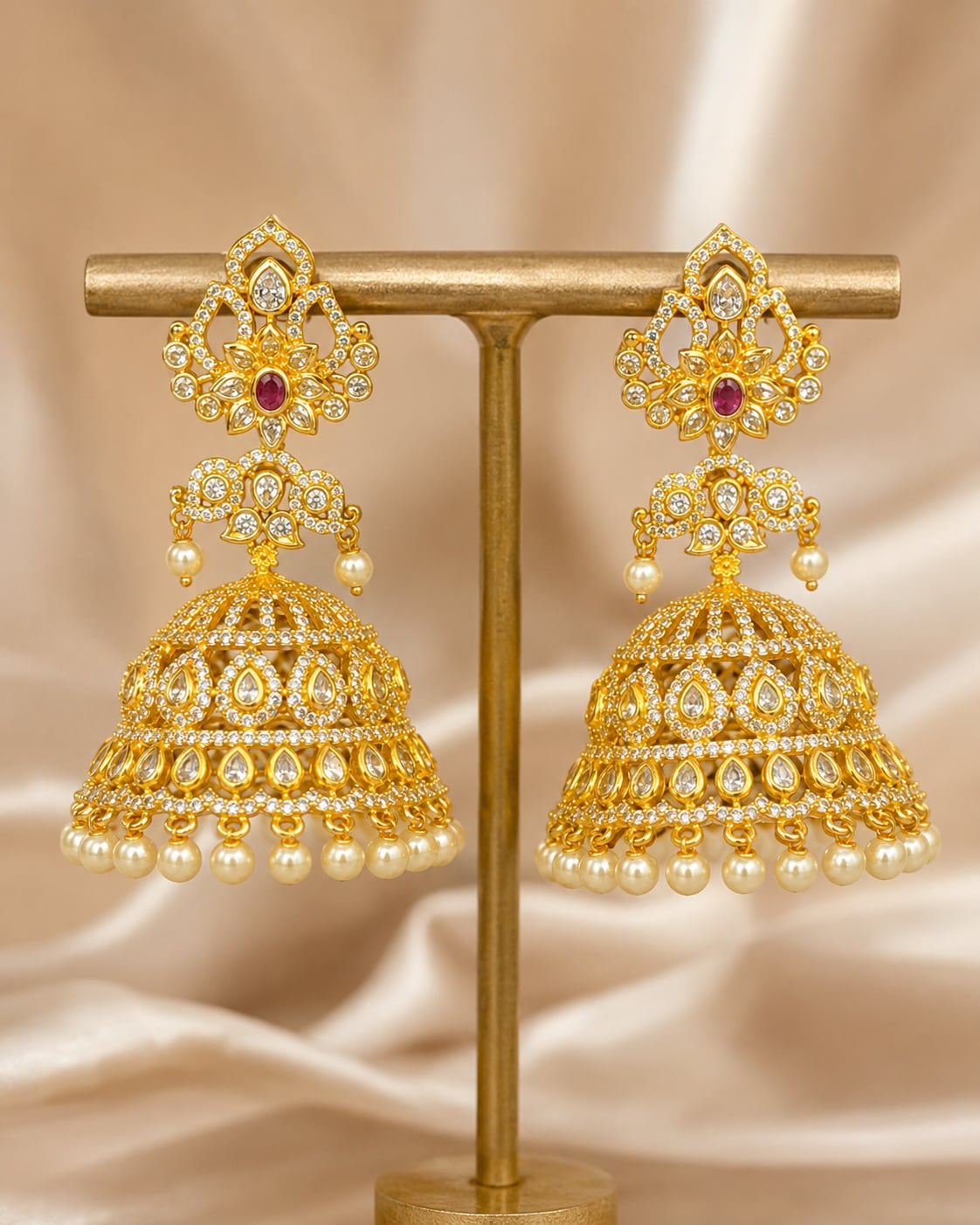 Pair of FeelOri grand gold-plated CZ jhumka earrings, front view