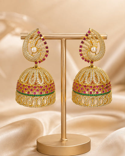 Front view of one matching pair of FeelOri gold-plated ruby fan CZ jhumka earrings with pearl-look drops