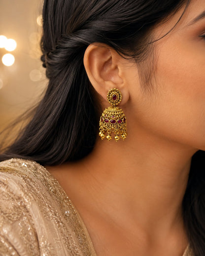 FeelOri gold-plated ruby jhumka earrings styled with Indian occasion wear
