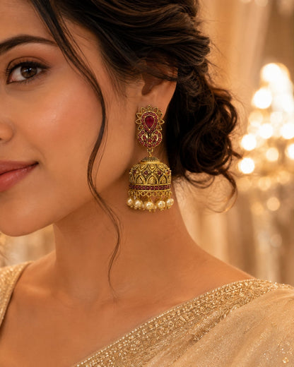 FeelOri gold-plated ruby jhumka earrings styled with Indian occasion wear