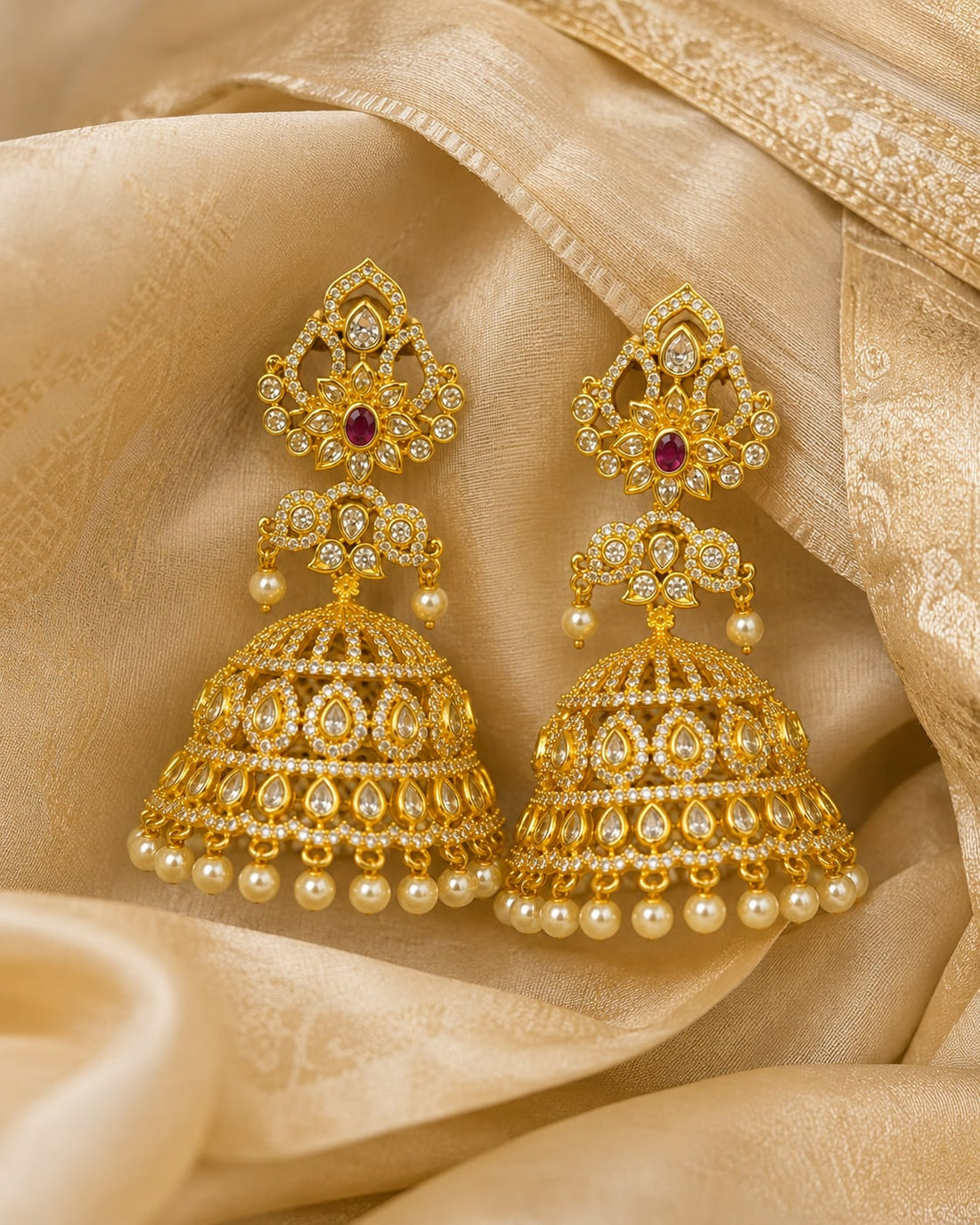 FeelOri grand ruby CZ jhumka earrings styled on Indian silk textile
