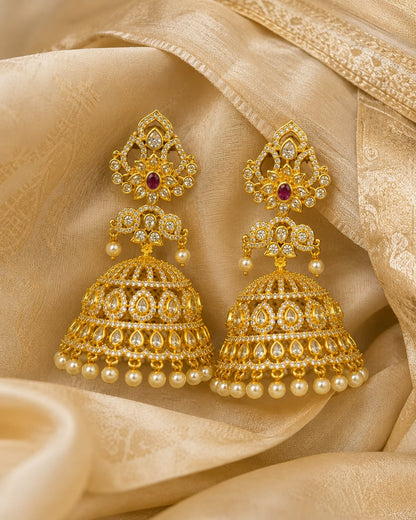 FeelOri grand ruby CZ jhumka earrings styled on Indian silk textile