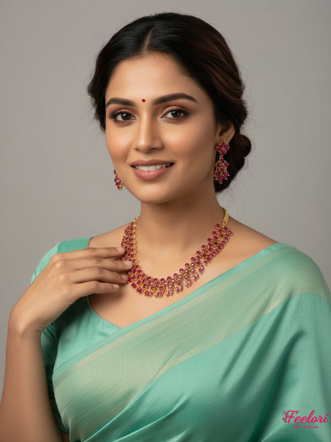FeelOri Gold Plated Ruby Necklace Set - Model wearing elegant set with light green traditional Indian saree.